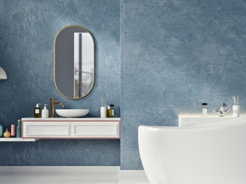 Customer bathroom renovation with blue walls and bathtub