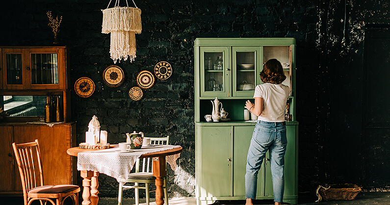 Hoosier kitchen cabinet with women and vintage kitchen
