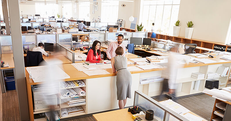 Open plan office layout with people working